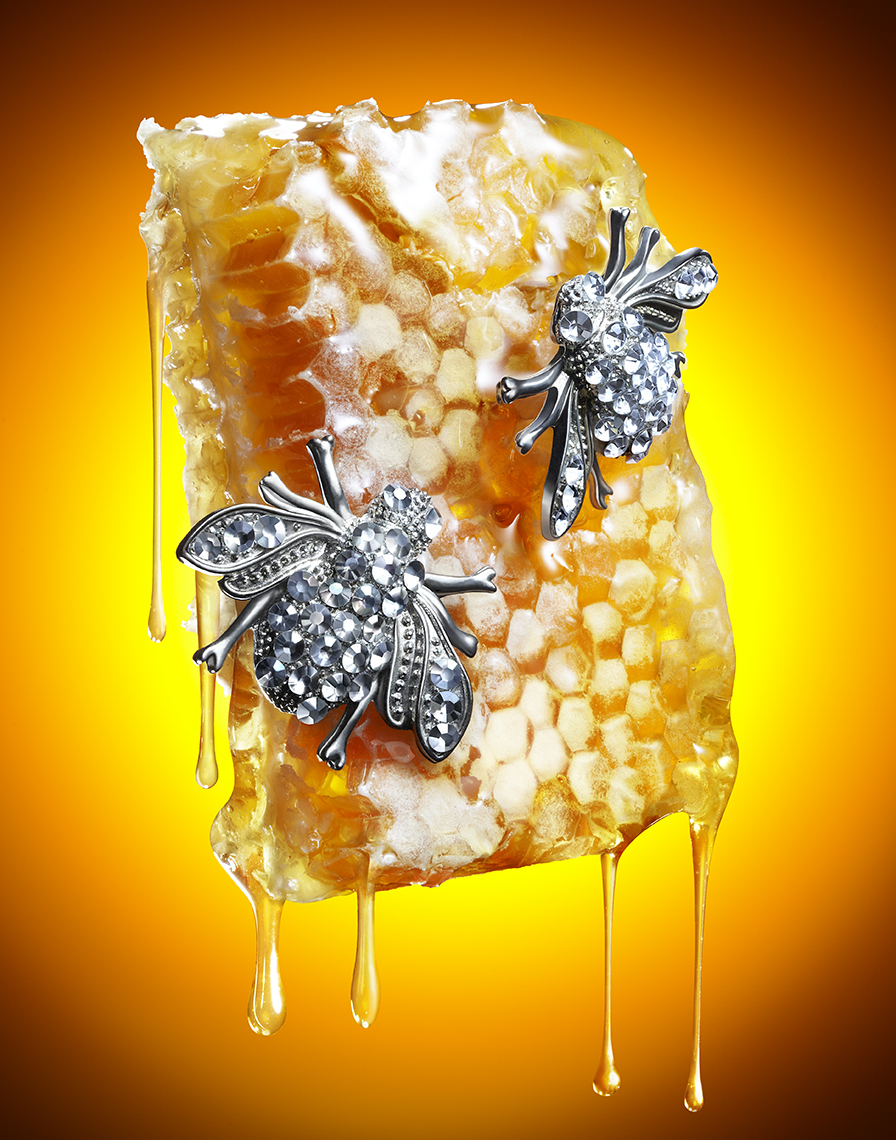 HONEY COMB WITH BEE SHAPED JEWELRY AND HONEY DRIPS SHOT BY DAVID FILIBERTI