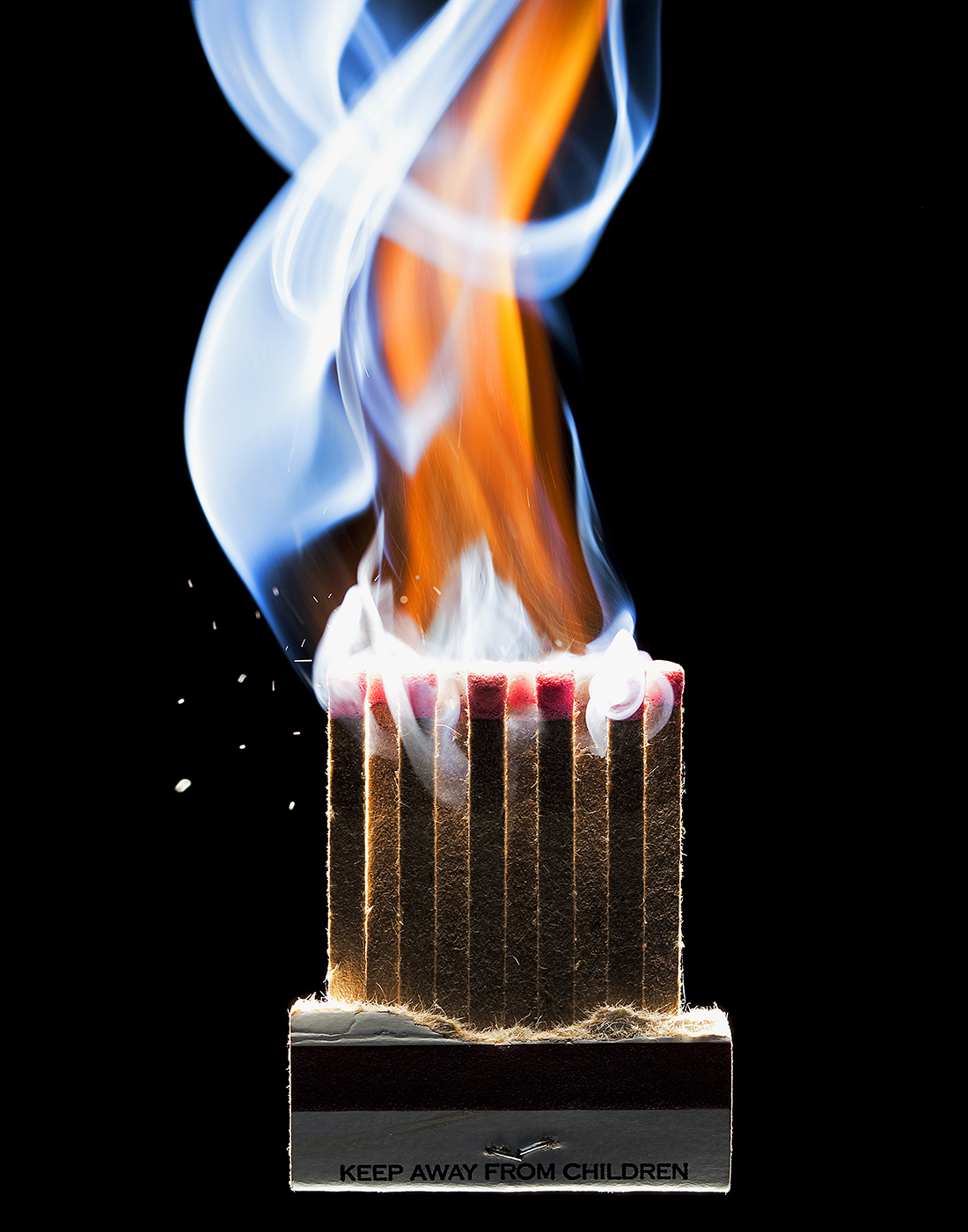 BOOK OF MATCHS SHOT AT THE EXACT MOMENT OF IGNITION SHOT BY DAVID FILIBERTI