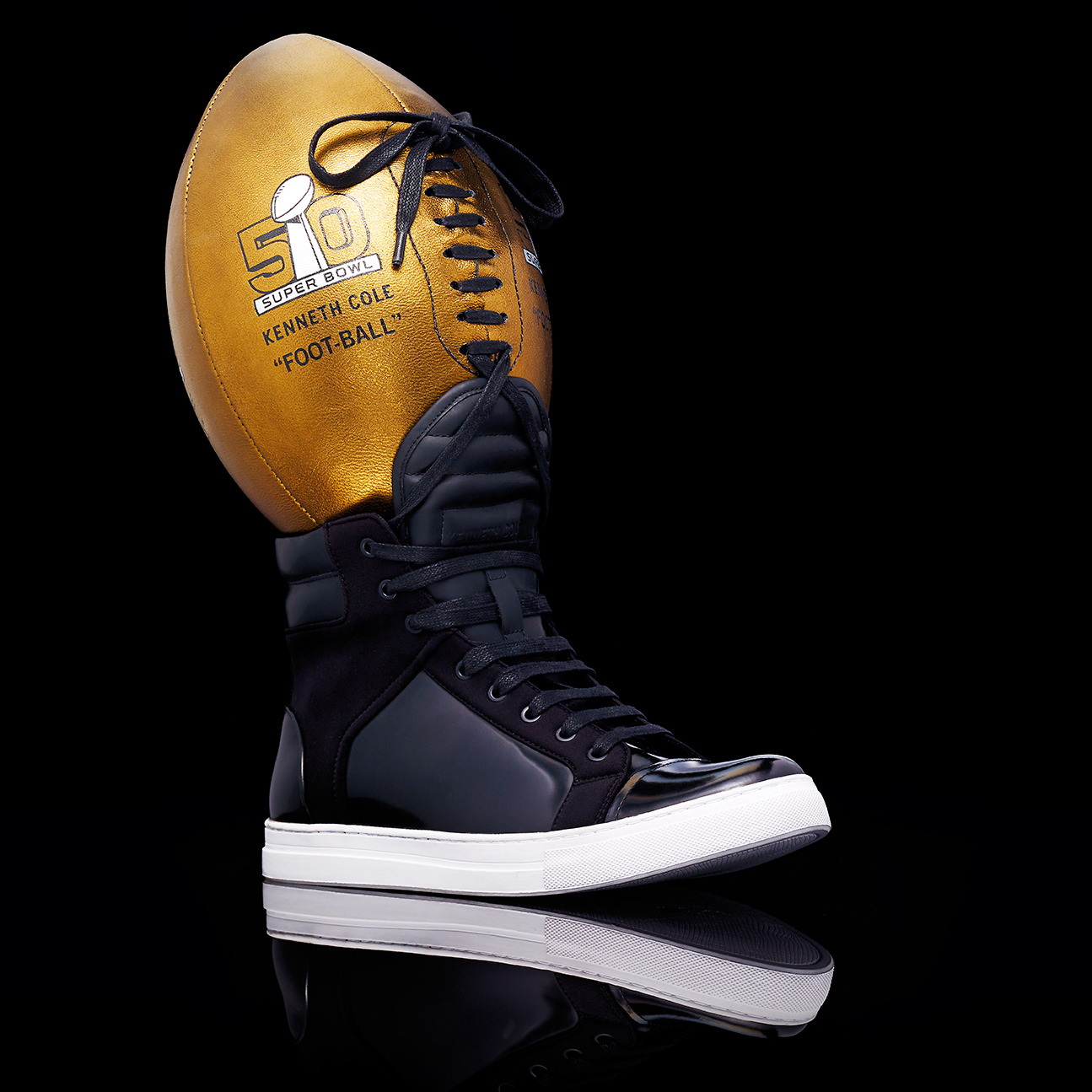 UNIQUE KENNITH COLE SHOE LACED TOGETHER WITH A SUPER BOWL 50 BALL SHOT BY DAVID FILIBERTI